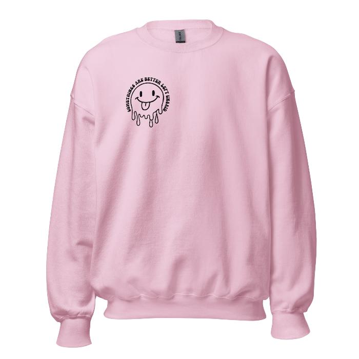 Pink crew neck sweatshirt with melting face and small slogan detail and full back print. Print shows Some things are better left unsaid.