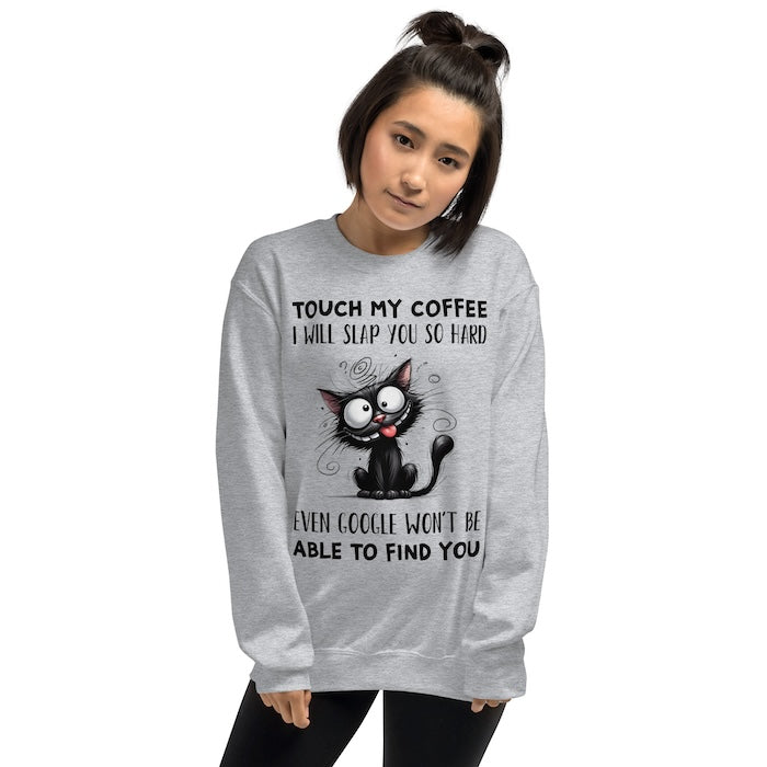 Woman wearing Grey unisex sweatshirt with quirky cat print and fun coffee slogan.