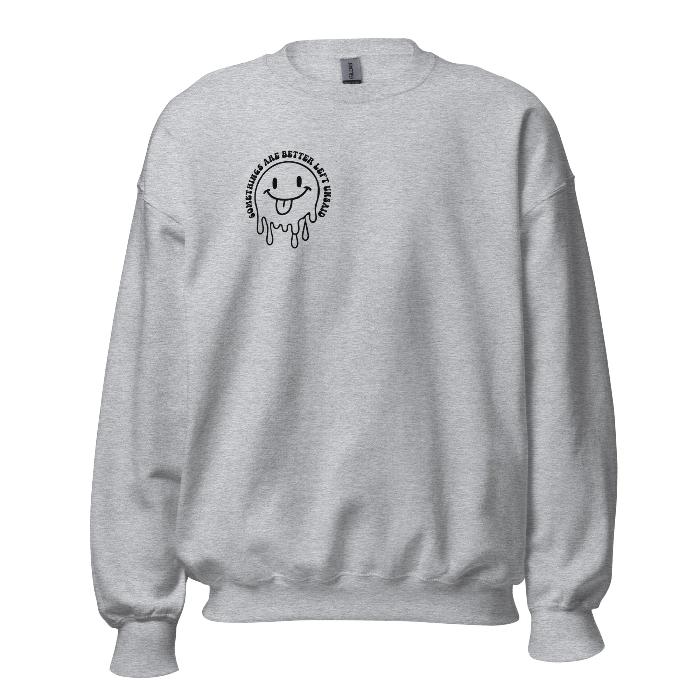 Grey crew neck sweatshirt with melting face and small slogan detail and full back print. Print shows Some things are better left unsaid.