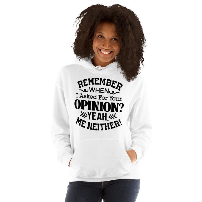 Woman wearing a white classic hoodie with pouch pocket and fun opinion slogan.